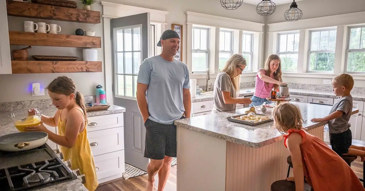 Family baking together in bright kitchen,