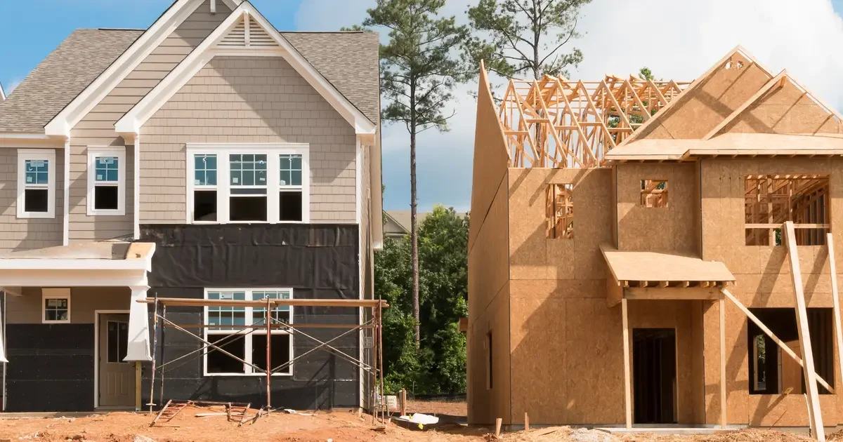 Home under construction next to completed home