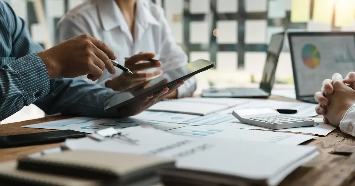 Close-up of hands on table at business meeting